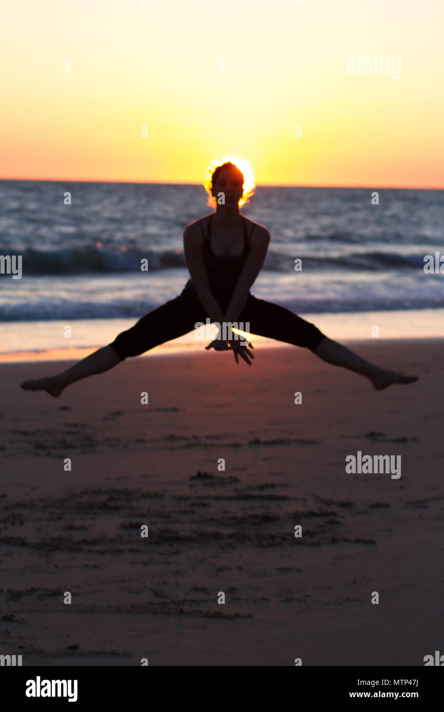 Dancer on the beach sunset time, free choreography Stock Photo