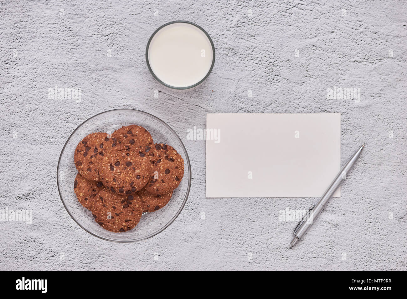 homemade oatmeal cookies with chocolate on an old white background. Stock Photo