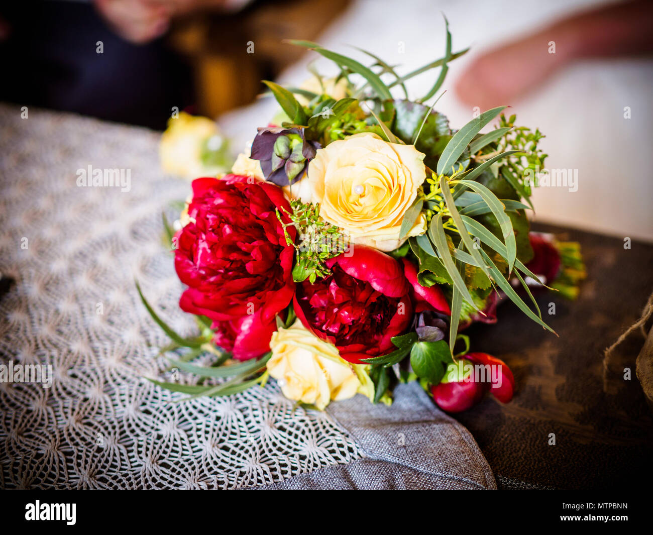 The bride holds a chic wedding bouquet of roses and peony Stock Photo ...