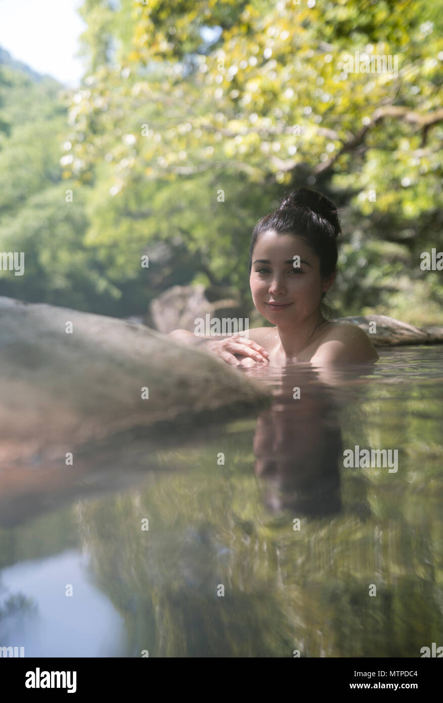 Woman Bathing In Outdoor Onsen Hot Spring At Myoken Ishikaraso Kirishima Kyushu Japan Stock