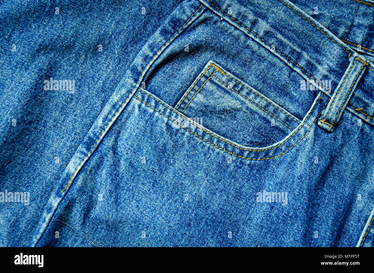 Background by blue jeans and jean lack, Close-up of jeans texture, Wallpaper by blue denim. Stock Photo