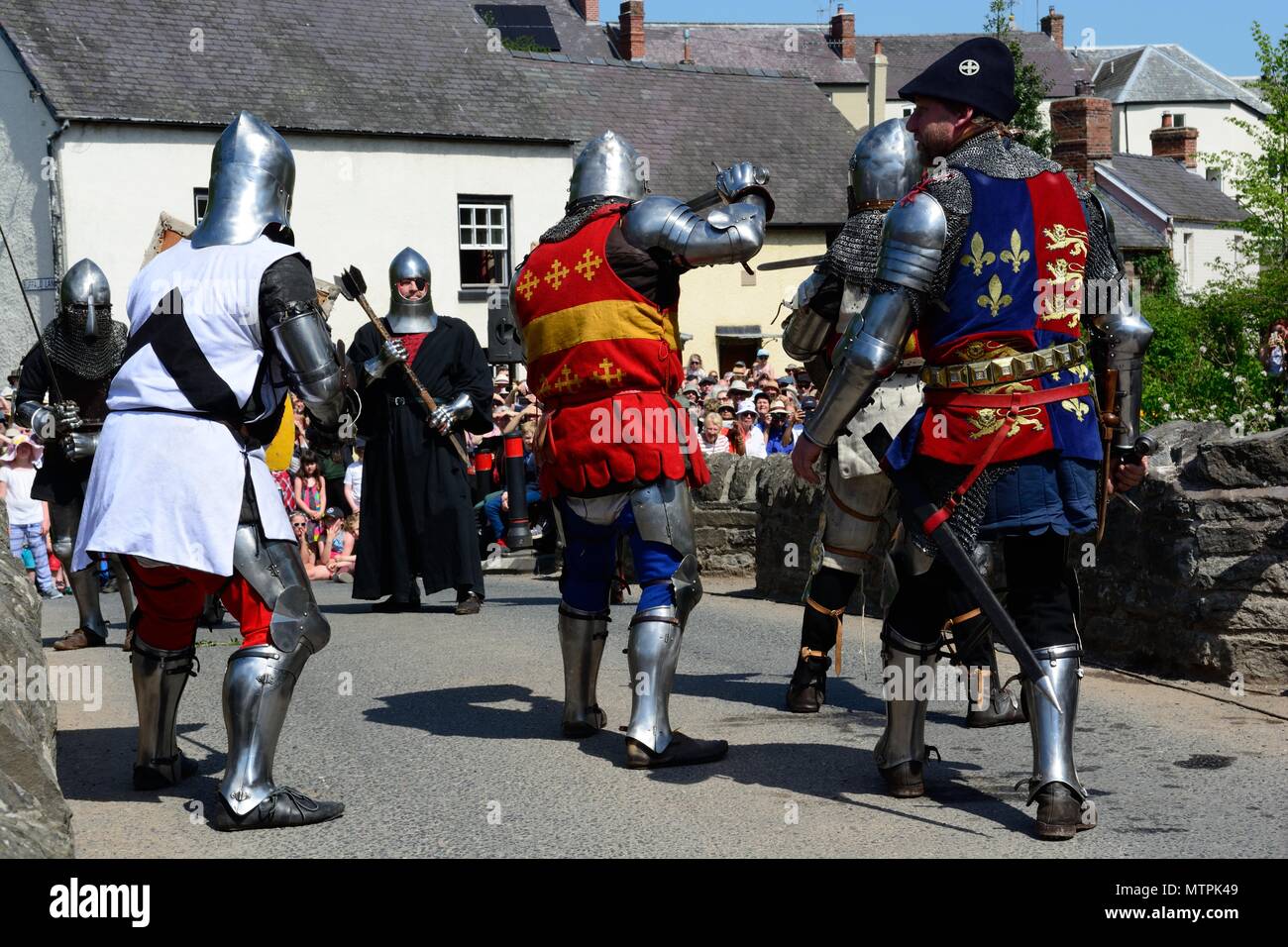 battle between the Medieval soldiers of the Ice Queen and The Green Man of Clun on Clun Bridge Shropshire England UK Stock Photo