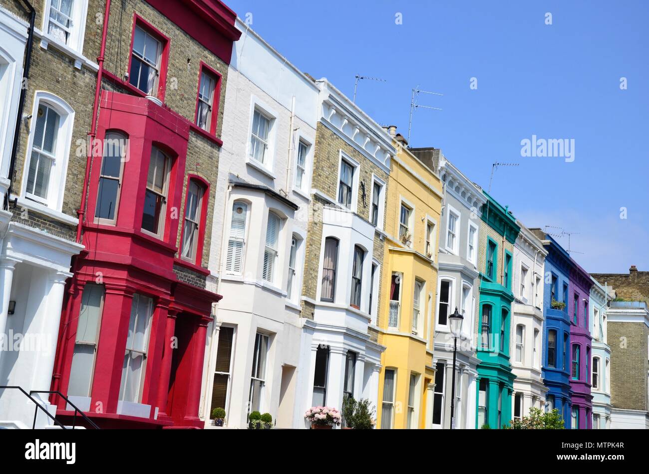 A row of colourful houses in Notting Hill, London, England, UK Stock