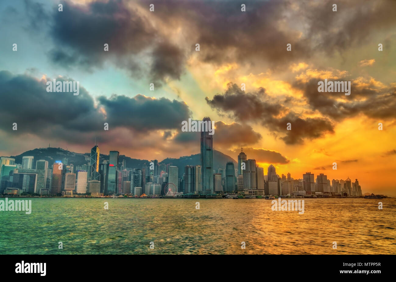 Sunset above Victoria Harbour in Hong Kong Stock Photo - Alamy