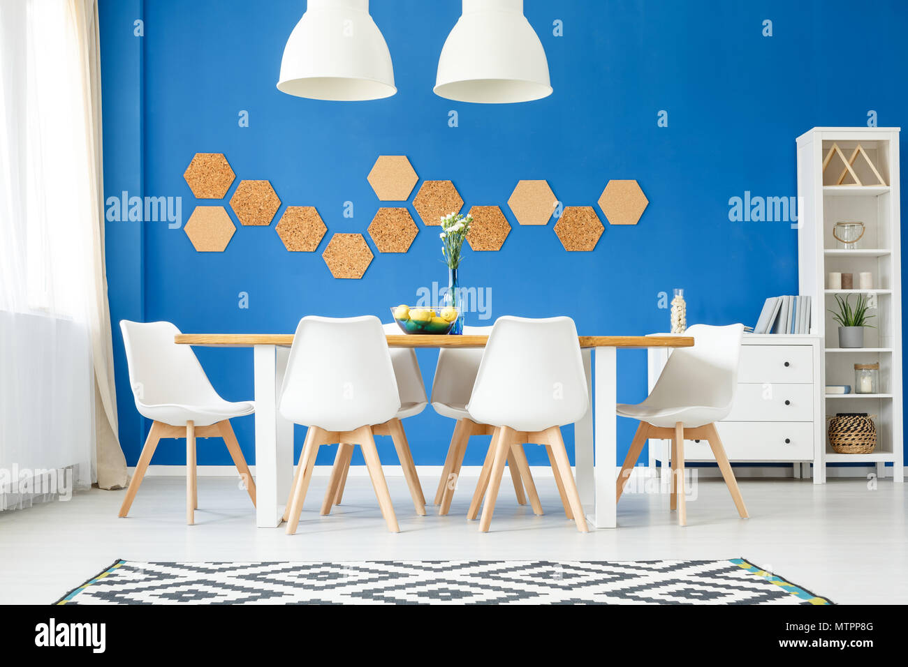 dining table with royal blue chairs