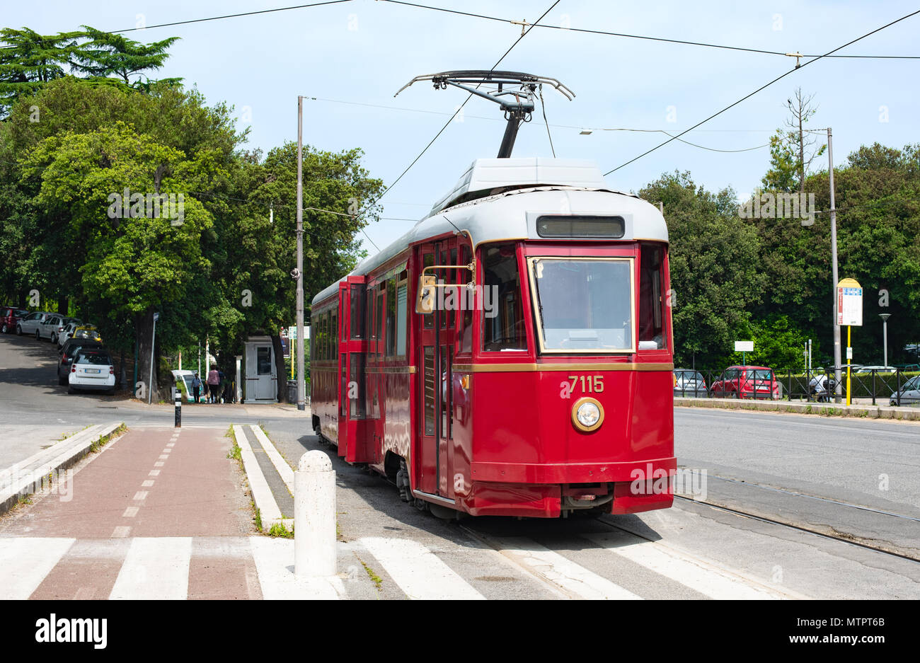 Vintage old electric tram at stop station, clean environment city means of transport Stock Photo