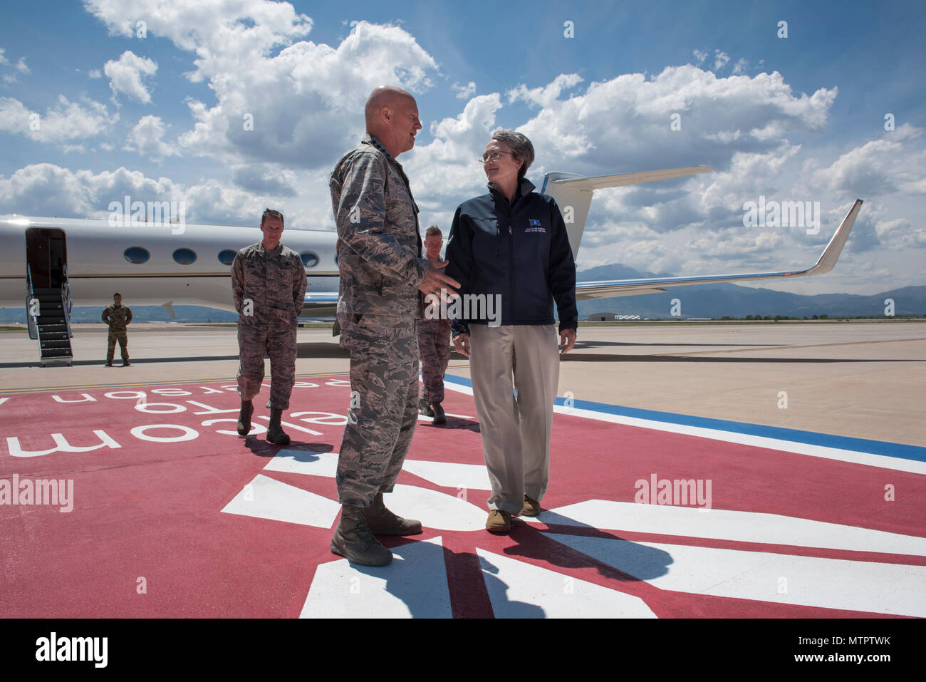 PETERSON AIR FORCE BASE, Colo. - U.S. Secretary of the Air Force Heather Wilson speaks with Gen. Jay Raymond, Air Force Space Command commander, on the flightline after arriving at Peterson Air Force Base, Colorado May 22, 2018. Wilson is attending the North American Aerospace Defense Command and Northern Command change of command ceremony where Air Force Gen. Terrence J. O'Shaughnessy will accept command from Air Force Gen. Lori J. Robinson. (DoD Photo by Senior Airman Dennis Hoffman) Stock Photo