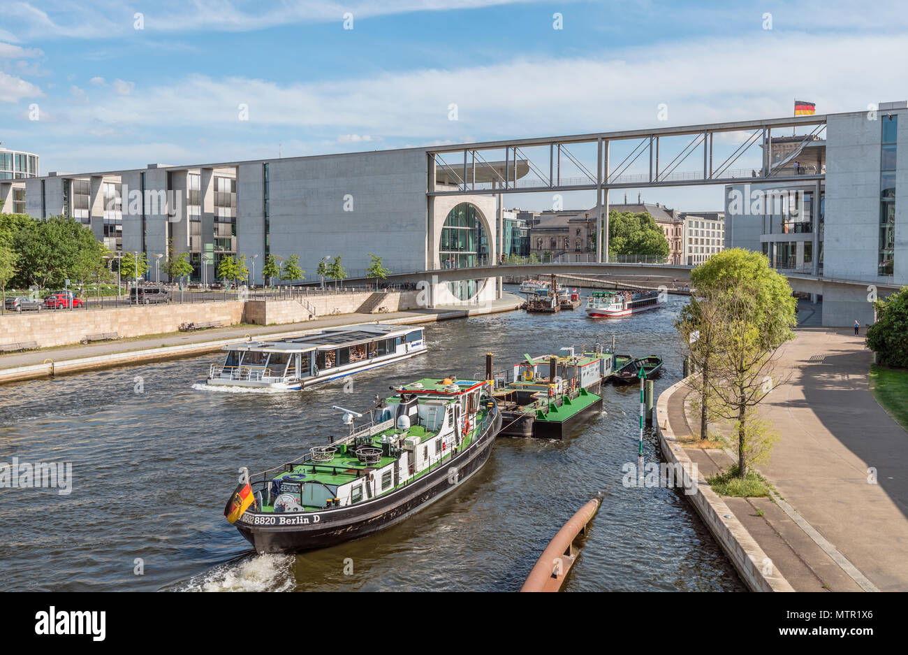 Sightseeing ship in front of the government quarter of Berlin, Germany Stock Photo