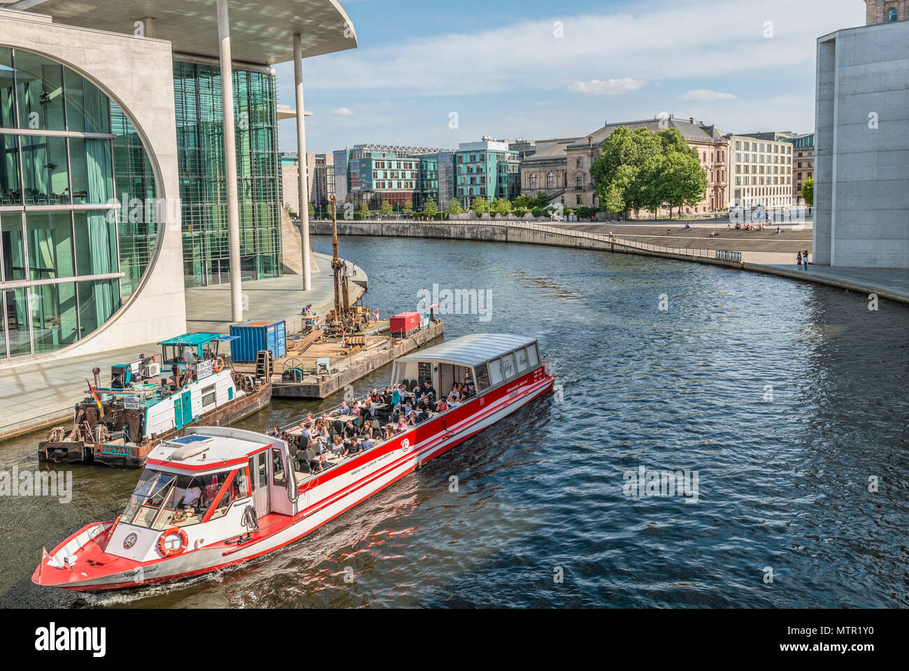 Sightseeing ship in front of the government quarter of Berlin, Germany Stock Photo