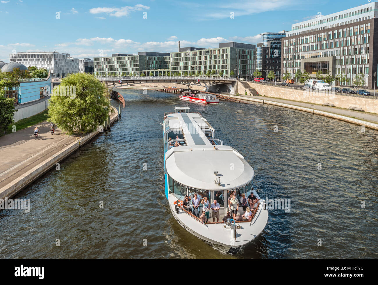 Sightseeing ship in front of the government quarter of Berlin, Germany Stock Photo