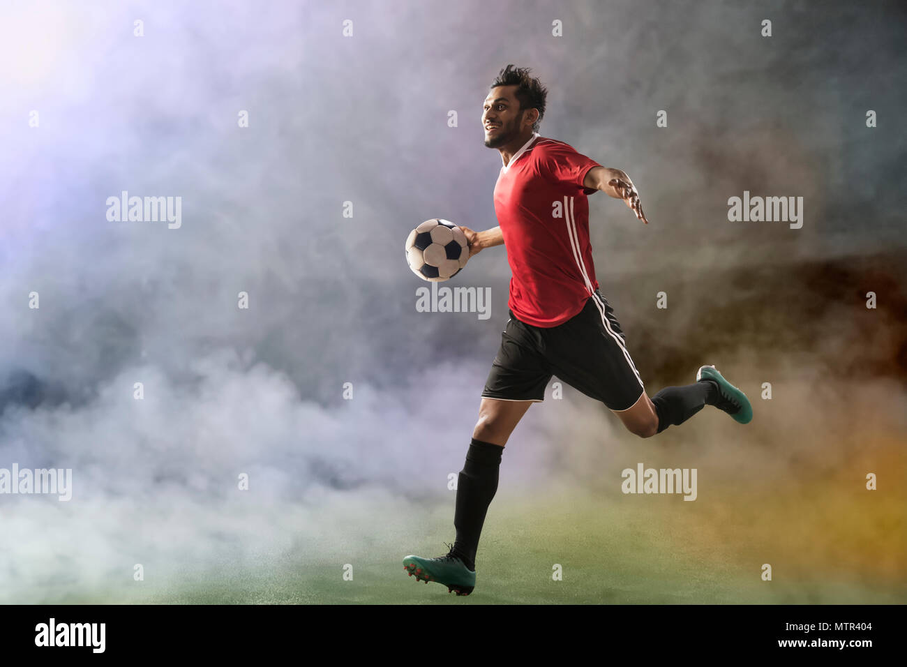 Footballer in goal celebration Stock Photo