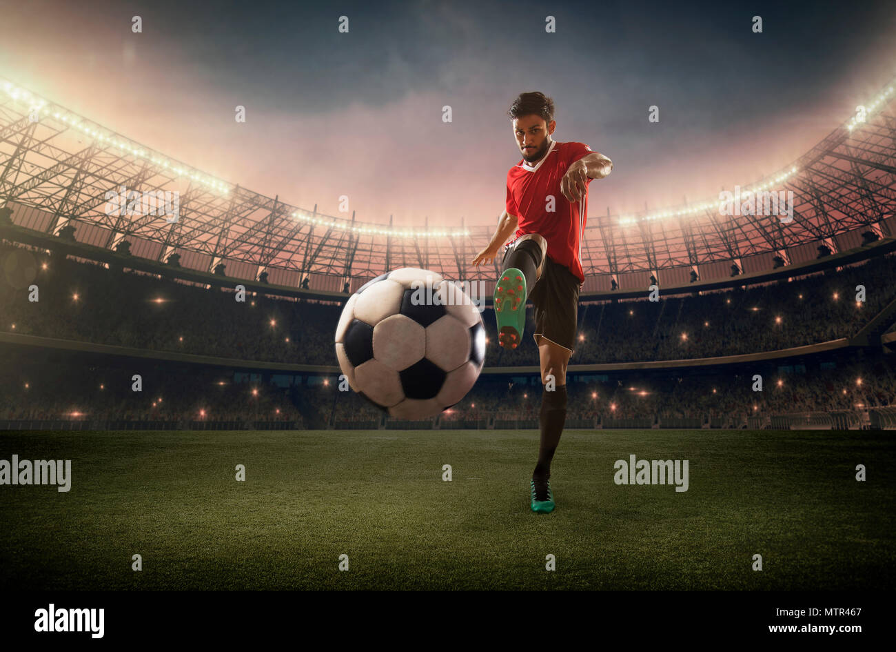 Football Player kicking the ball Stock Photo Alamy