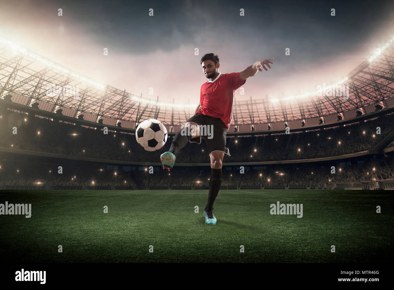 Football Player kicking the ball Stock Photo Alamy