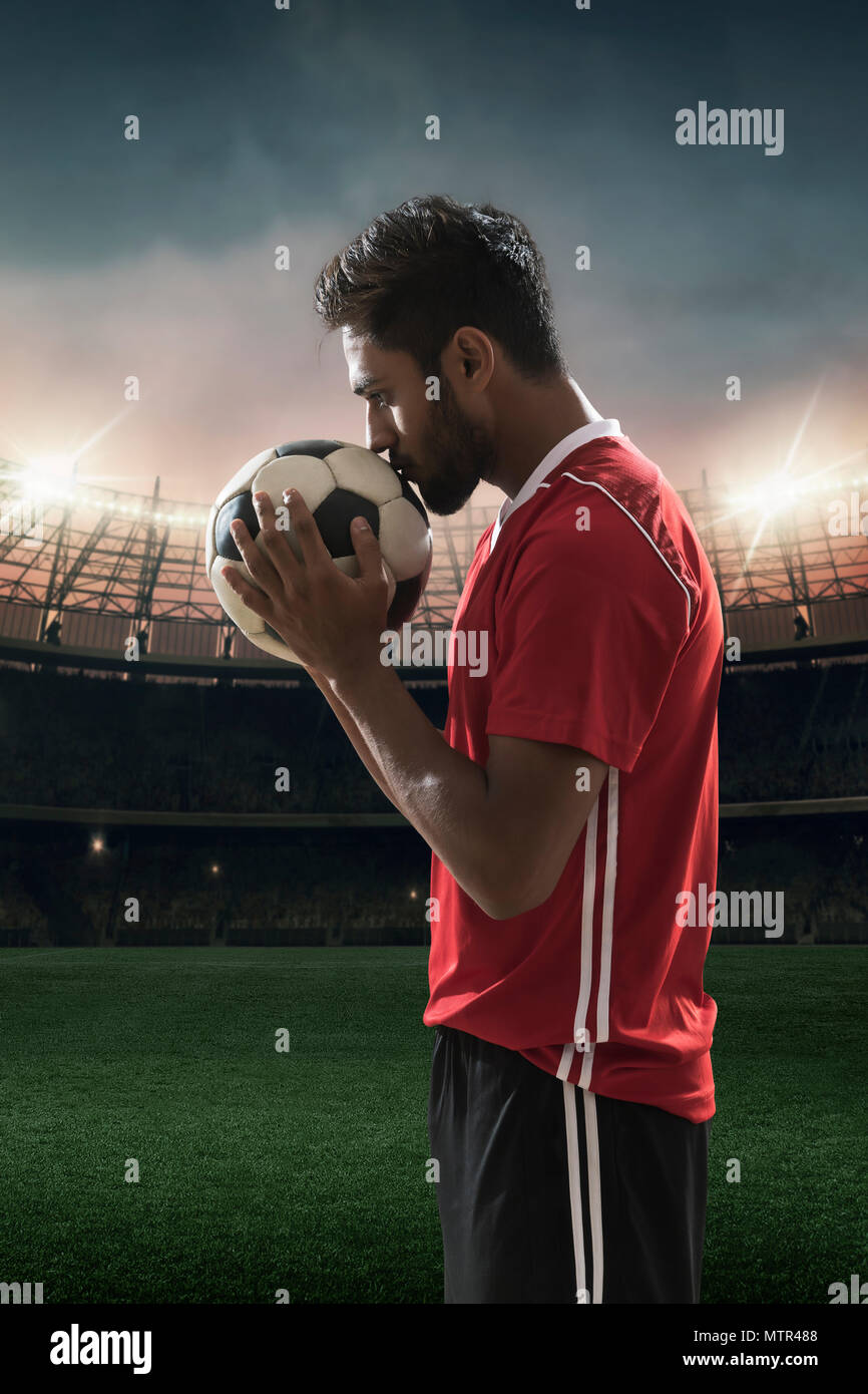 Footballer kissing football hires stock photography and images Alamy