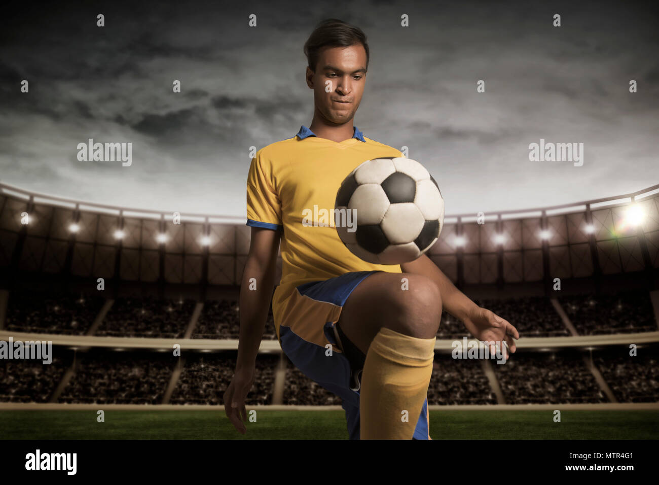 Male football player practising kickups Stock Photo Alamy