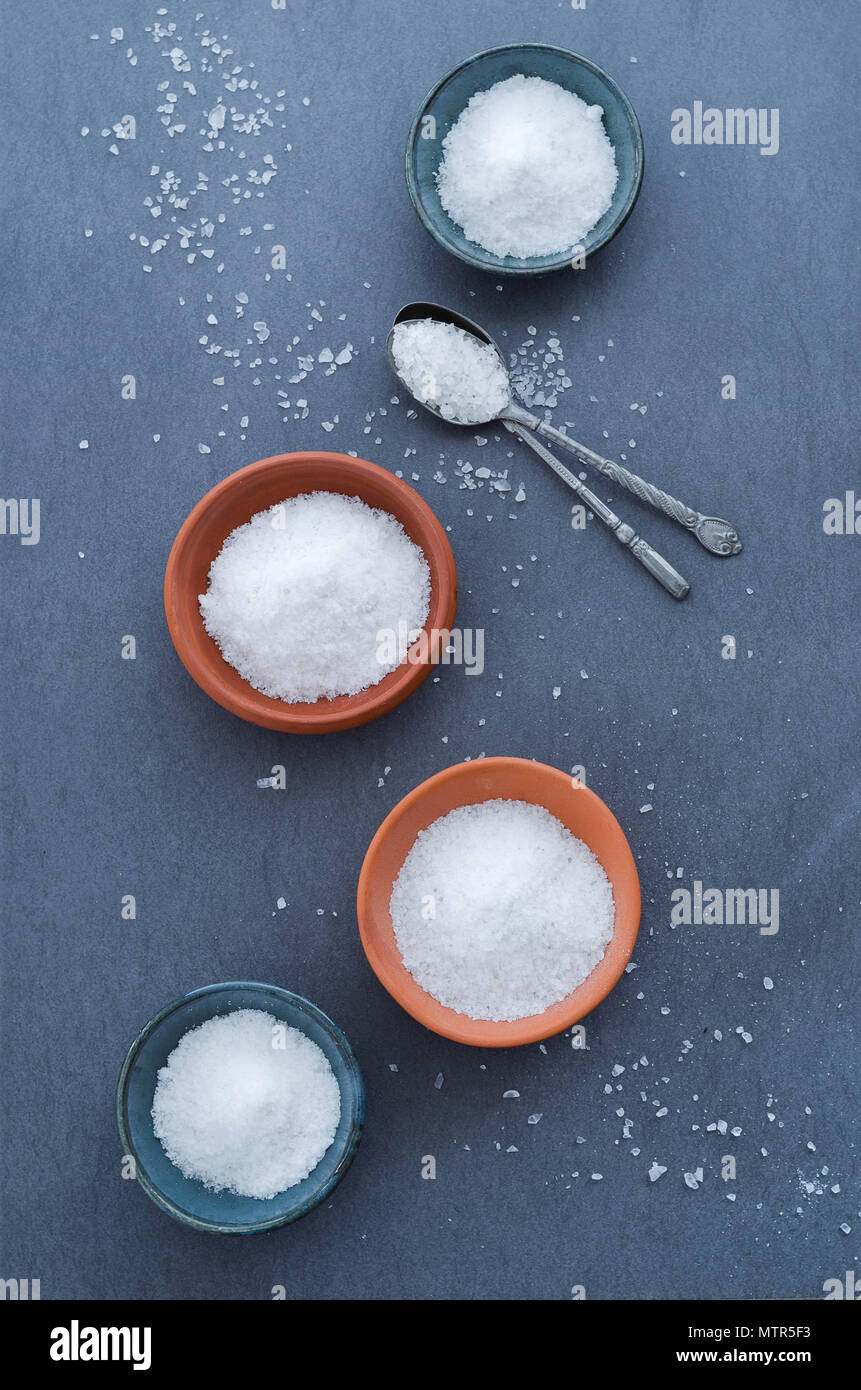 Salt in rustic ceramic bowls, top view Stock Photo