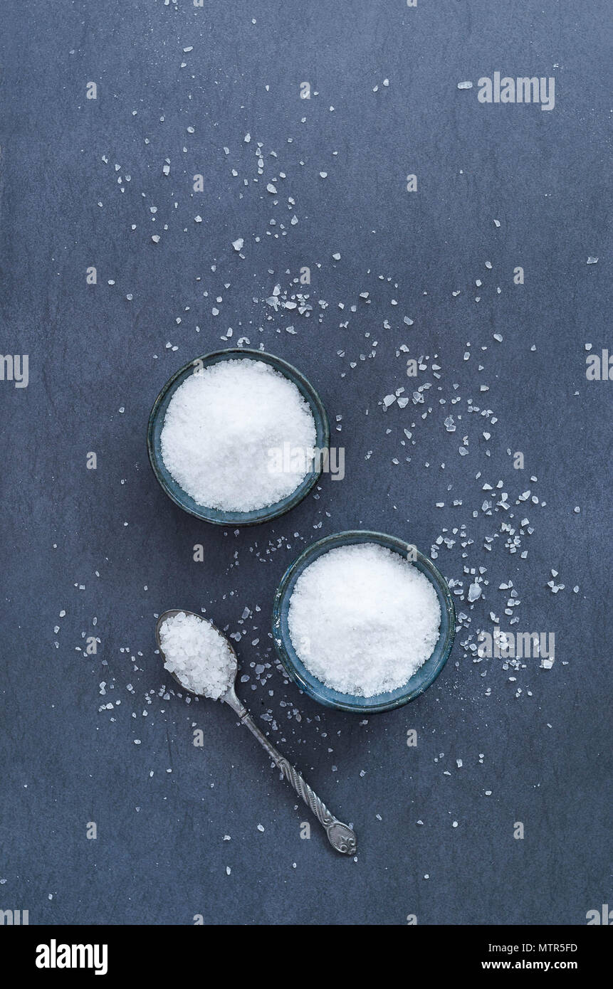 Salt in rustic ceramic bowls, top view Stock Photo