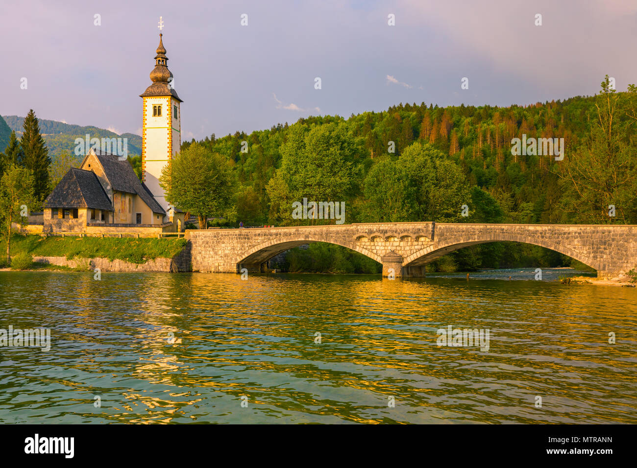 The church of St. John the Baptist at Lake Bohinj. Lake Bohinj is the ...