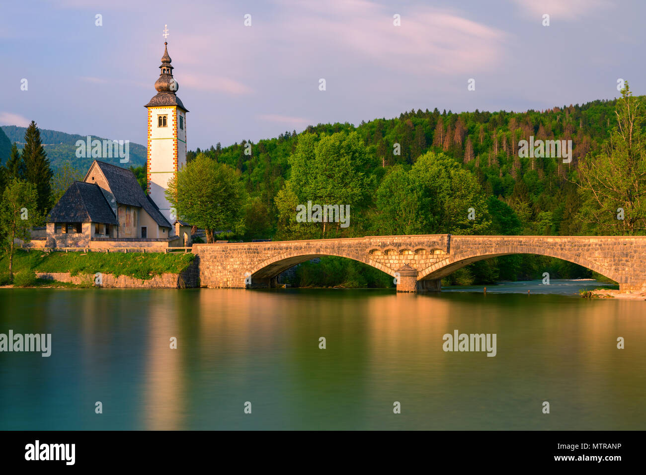 The church of St. John the Baptist at Lake Bohinj. Lake Bohinj is the ...