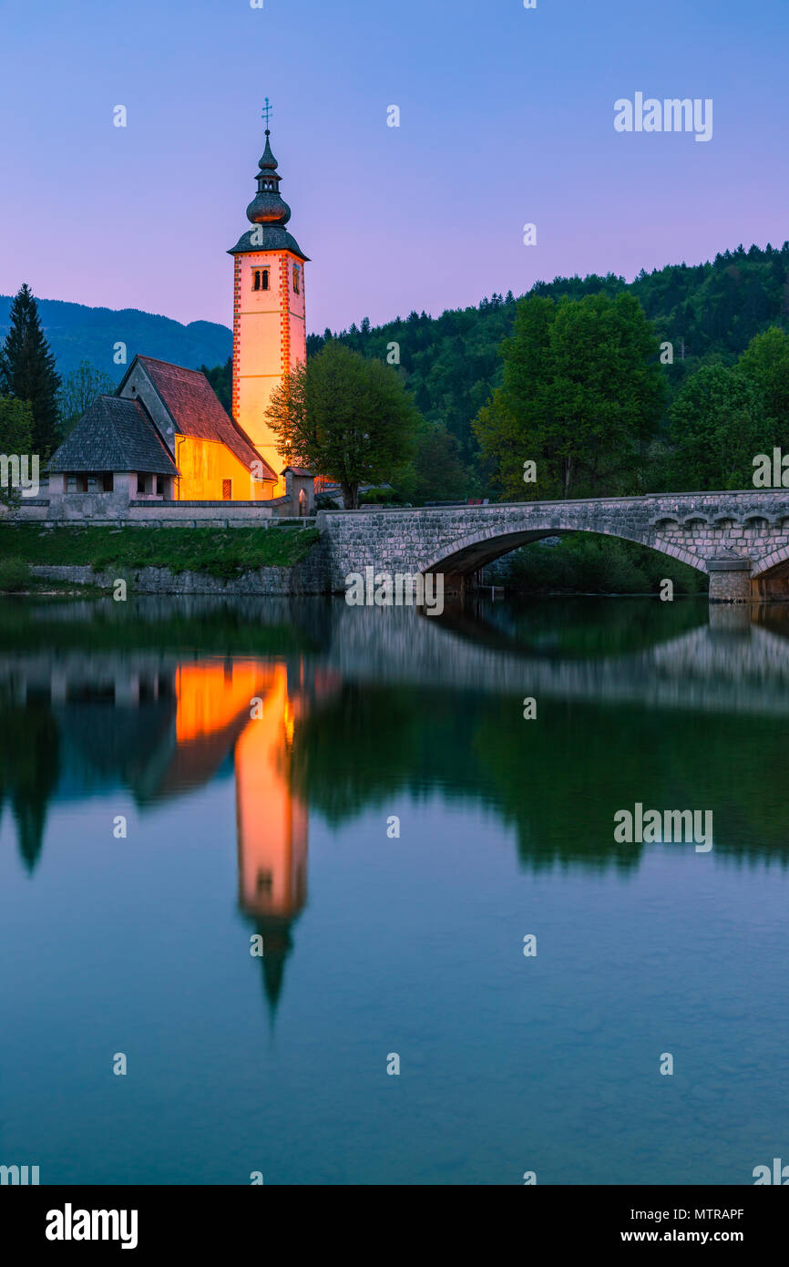 The church of St. John the Baptist at Lake Bohinj. Lake Bohinj is the ...