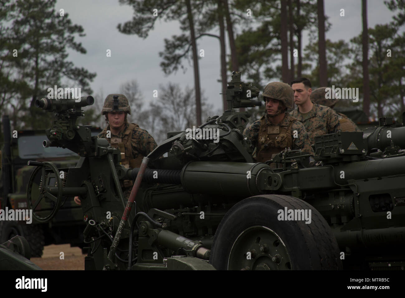 Marines with the Artillery Training School set up an M777A2 towed 155mm howitzer at Camp Lejeune, N.C., Jan. 18, 2017. The howitzer weighs approximately 9,800 pounds and is capable of firing 155mm rounds, which can destroy large enemy targets or illuminate the battlefield to provide support for infantry units. (U.S. Marine Corps photo by Lance Cpl. Juan A Soto-Delgado) Stock Photo