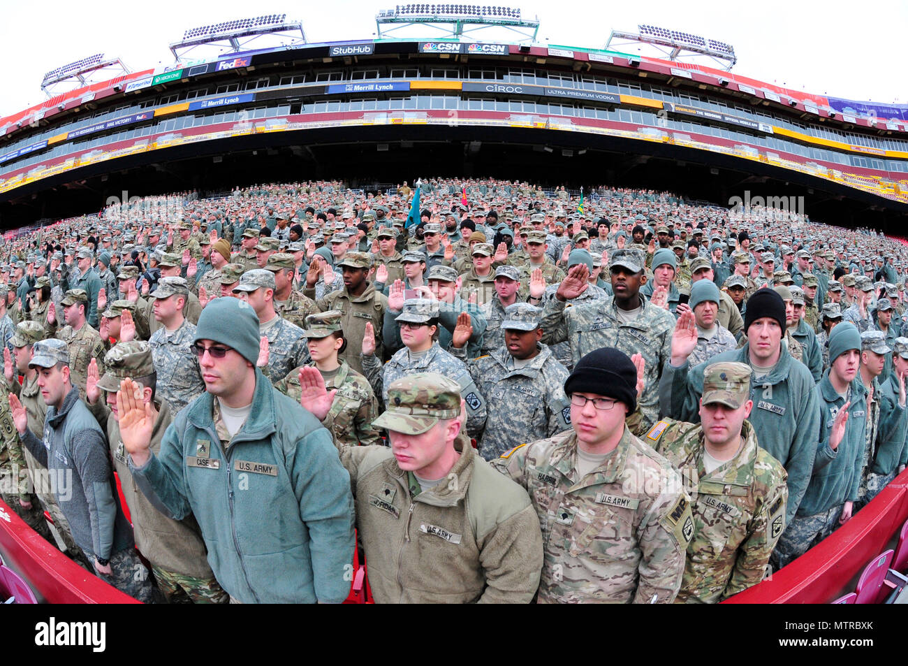 National Guard soldiers and airmen swear in as District of Columbia special police at FedEx Field in Landover, Md., Jan. 19, 2017. The troops are here in preparation for the 58th Presidential Inauguration. During the event, National Guard troops from almost every state and territory will provide several critical functions including crowd management, traffic control, emergency services, logistics, and ceremonial marching elements. (U.S. Army National Guard photo by 2nd Lt. Brendan Mackie/Released) Stock Photo