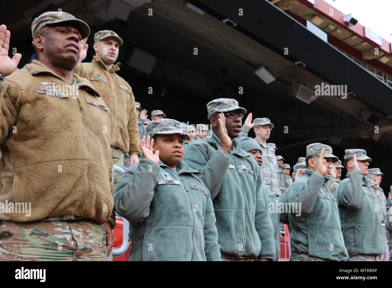 National Guard soldiers and airmen swear in as District of Columbia special police at FedEx Field in Landover, Md., Jan. 19, 2017. The National Guard members are here in preparation of the 58th Presidential Inauguration. During the historic event, National Guard troops from almost every state and territory will provide several critical functions including crowd management, traffic control, emergency services, logistics, and ceremonial marching elements. (U.S. Army National Guard photo by 2nd Lt. Wendy Callaway) Stock Photo