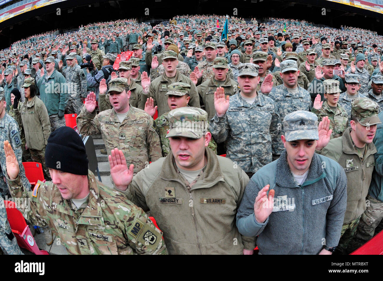 National Guard soldiers and airmen swear in as District of Columbia special police at FedEx Field in Landover, Md., Jan. 19, 2017. The National Guard members are here in preparation of the 58th Presidential Inauguration. During the historic event, National Guard troops from almost every state and territory will provide several critical functions including crowd management, traffic control, emergency services, logistics, and ceremonial marching elements. (U.S. Army National Guard photo by 2nd Lt. Brendan Mackie) Stock Photo