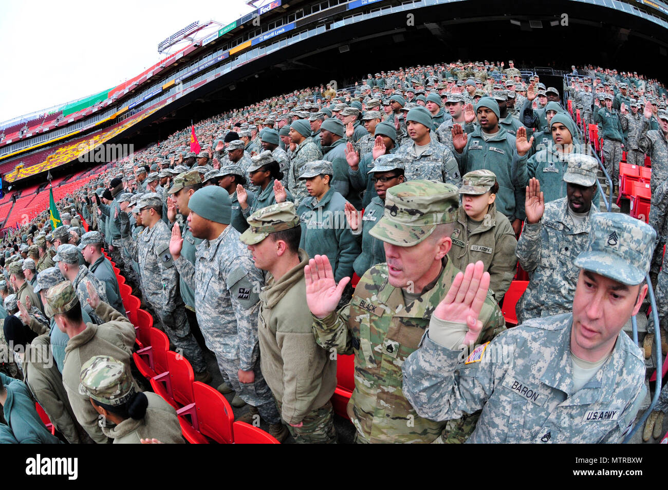 Delaware National Guard soldiers and airmen swear in as District of Columbia special police at FedEx Field in Landover, Md., Jan. 19, 2017. The DNG members are here in preparation of the 58th Presidential Inauguration. During the historic event, National Guard troops from almost every state and territory will provide several critical functions including crowd management, traffic control, emergency services, logistics, and ceremonial marching elements. (U.S. Army National Guard photo by 2nd Lt. Brendan Mackie) Stock Photo