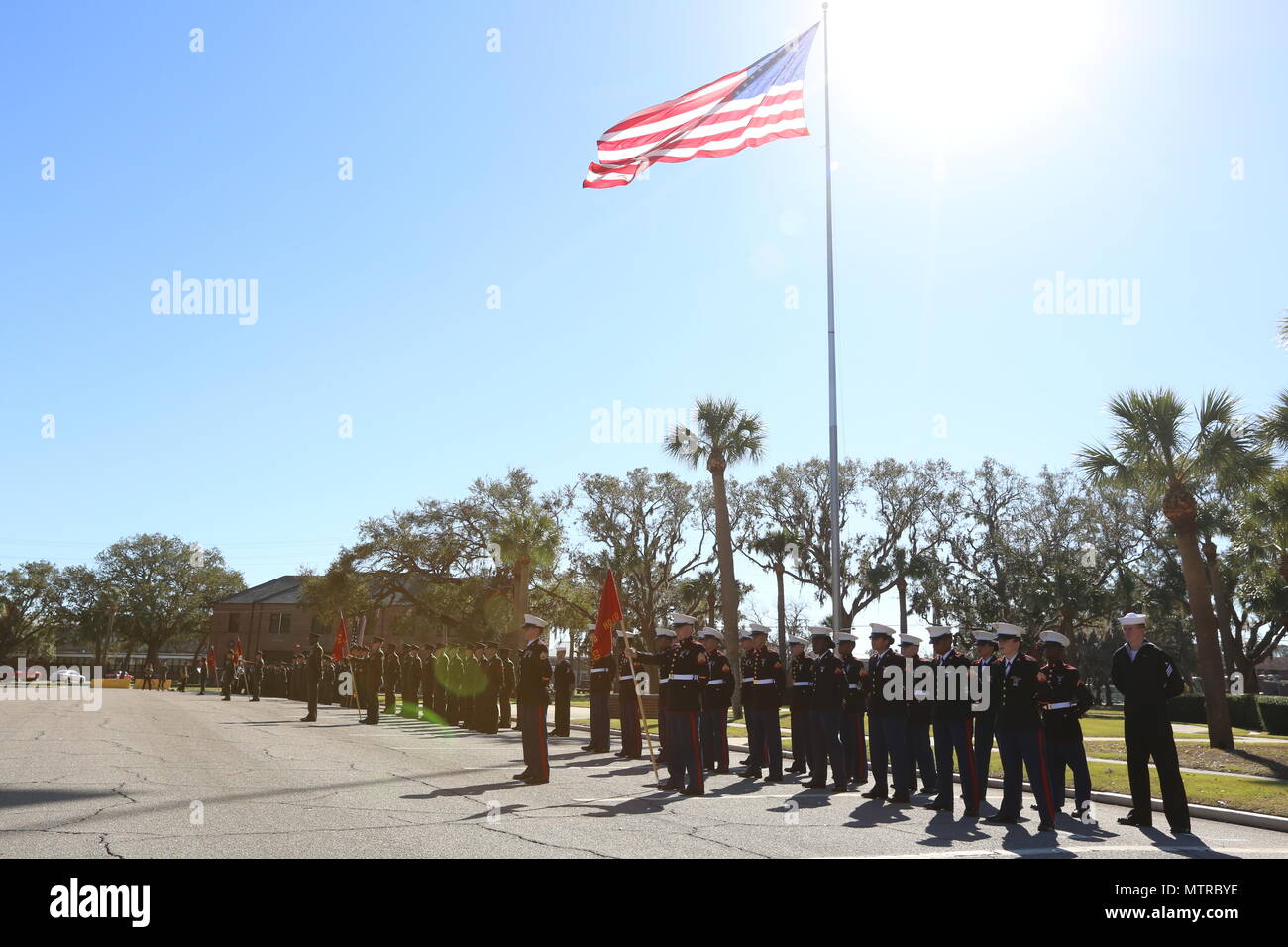 U.S. Marines stationed on Marine Corps Recruit Depot Parris Island (MCRD PI) stand in formation during a relief and appointment ceremony at the General’s Building on MCRD PI, S. C., Jan. 13, 2017. Sgt. Maj. Angela M. Maness retired after 30 faithful years of service and was relieved of her duty as MCRD PI/Eastern Recruiting Region Sergeant Major by Sgt. Maj. Rafael Rodriguez. (U.S. Marine Corps photo by Lance Cpl. Colby Cooper/released) Stock Photo