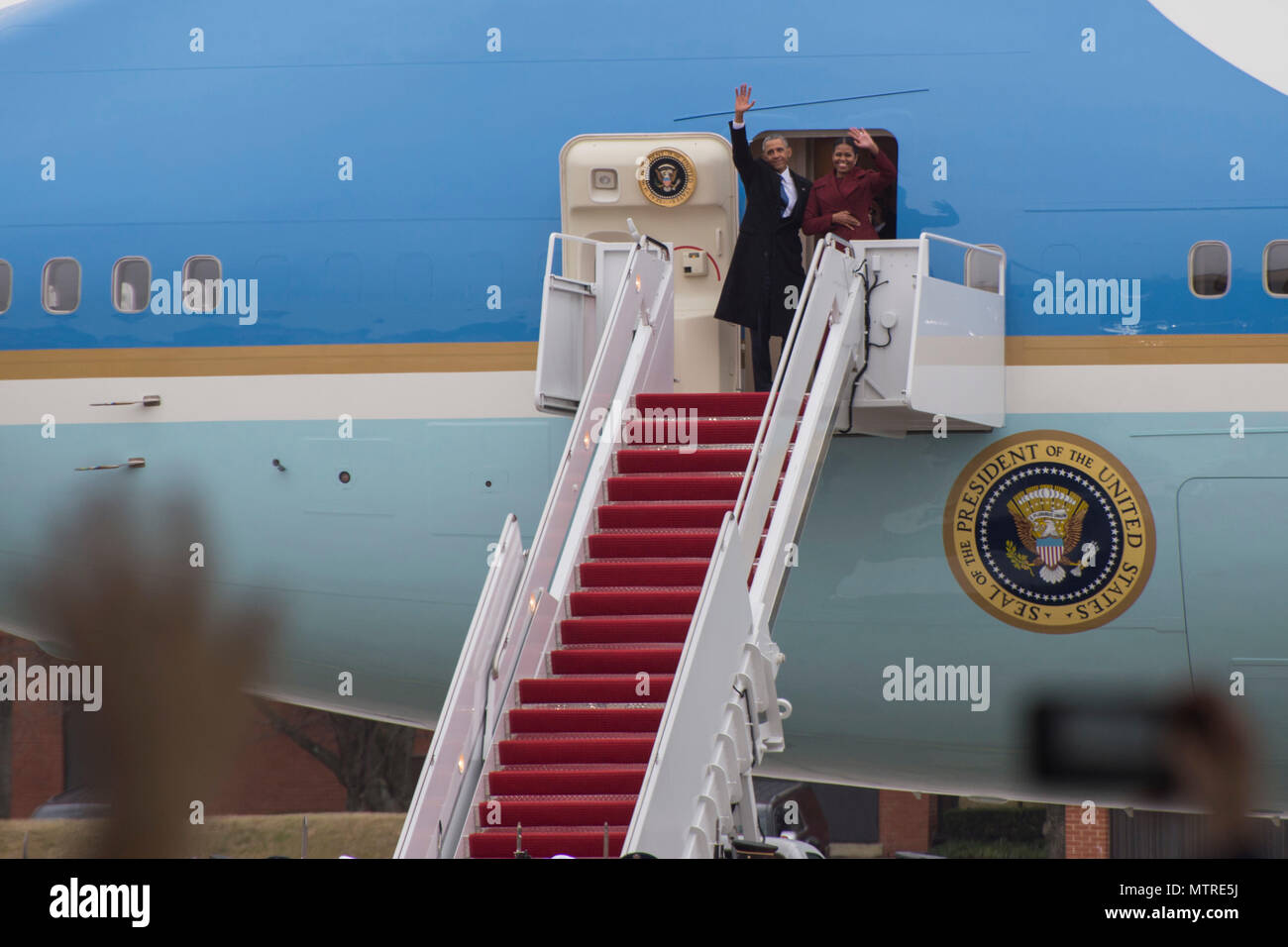 Former President Barack Obama and his wife Michelle wave goodbye after his farewell speech on Joint Base Andrews, Md., Jan. 20, 2017. Throughout his eight-year tenure as president, Obama traveled to and from JBA aboard Air Force One more than 600 times, traveling around the world. (U.S. Air Force photo/Senior Airman Ryan J. Sonnier/Released) Stock Photo