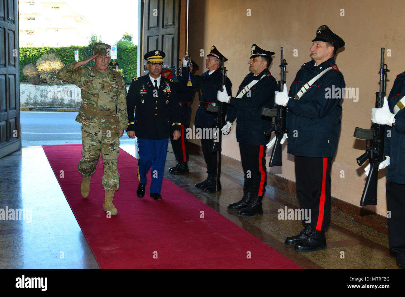 Lt. Gen. Charles D. Luckey (left), Commanding General U.S. Army Reserve Command, U.S. Army Col. Darius S. Gallegos (center), CoESPU deputy director, browse the Italian Carabinieri honor guard during visit at Center of Excellence for Stability Police Units (CoESPU) Vicenza, Italy, January 20, 2017.(U.S. Army Photo by Visual Information Specialist Paolo Bovo/released) Stock Photo