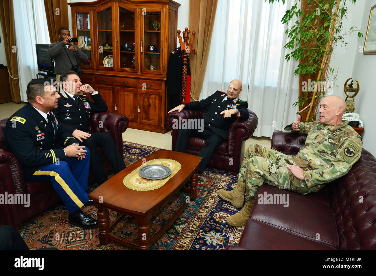 Lt. Gen. Charles D. Luckey (right), Commanding General U.S. Army Reserve Command, Lt. Gen Vincenzo Coppola (center), Commanding General “Palidoro” Carabinieri Specialized and Mobile Units, Brig. Gen. Giovanni Pietro Barbano, Center of Excellence for Stability Police Units (CoESPU) director and U.S. Army Col. Darius S. Gallegos (left), CoESPU deputy director, talk during visit at Center of Excellence for Stability Police Units (CoESPU) Vicenza, Italy, January 20, 2017.(U.S. Army Photo by Visual Information Specialist Paolo Bovo/released) Stock Photo