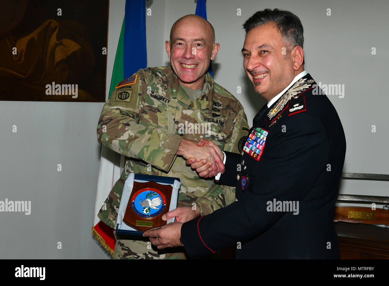 Brig. Gen. Giovanni Pietro Barbano (right), Center of Excellence for Stability Police Units (CoESPU) director, presents  Carabinieri CoESPU crest at Lt. Gen. Charles D. Luckey (left), Commanding General U.S. Army Reserve Command, during visit at Center of Excellence for Stability Police Units (CoESPU) Vicenza, Italy, January 20, 2017.(U.S. Army Photo by Visual Information Specialist Paolo Bovo/released) Stock Photo