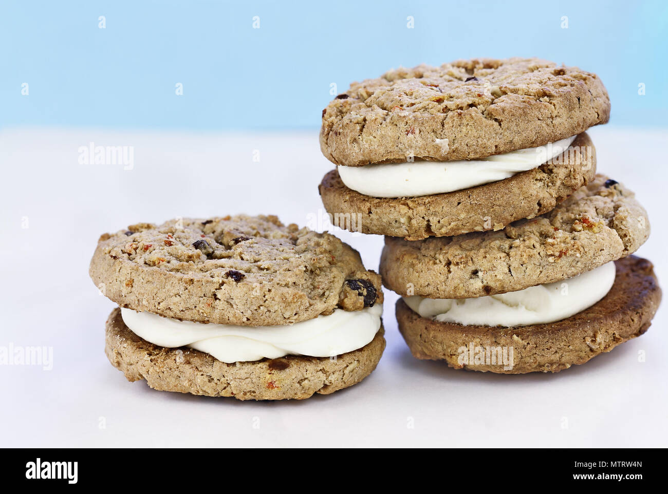 Carrot cake raisin cookies sandwiches stuffed with cream cheese icing