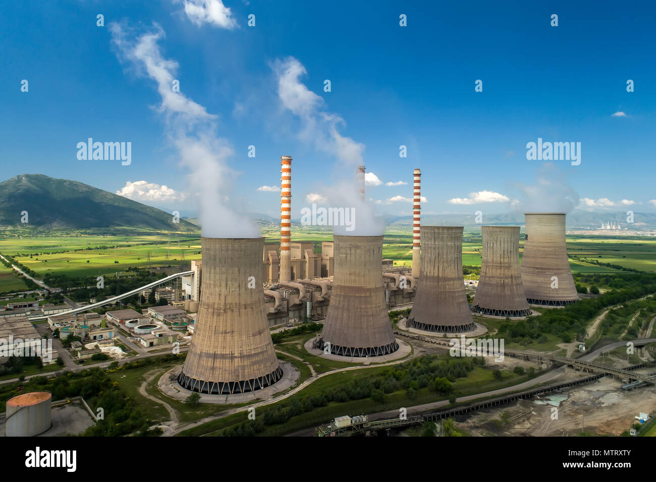 Aerial view the plant producing electrical energy with large pipes at Kozani in northern Greece. Stock Photo