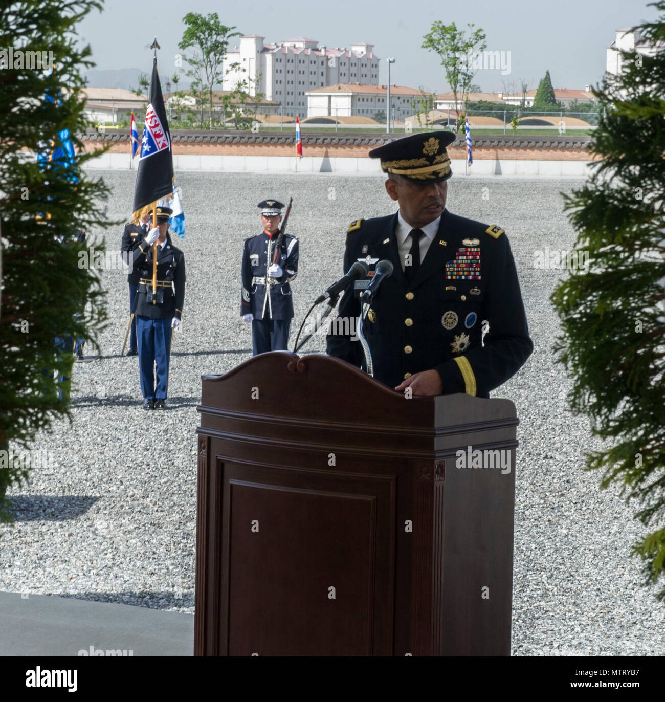 U.S. Army Gen. Vincent K. Brooks, United Nations Command, Combined Forces Command, United States Forces Korea commanding general, recognizes the sacrifices of U.S. and Korean service members during a Memorial Day Honor Guard ceremony at Barker Field, U.S. Army Garrison Humphreys, Republic of Korea, May 24, 2018. During the ceremony, Brooks announced the naming of Barker Field in honor of Private First Class Charles Barker, a South Carolina native and Korean War Medal of Honor recipient who fought hand-to-hand on Pork Chop Hill covering an allied retreat. Stock Photo