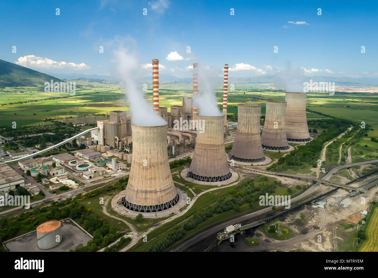 Aerial view the plant producing electrical energy with large pipes at Kozani in northern Greece. Stock Photo