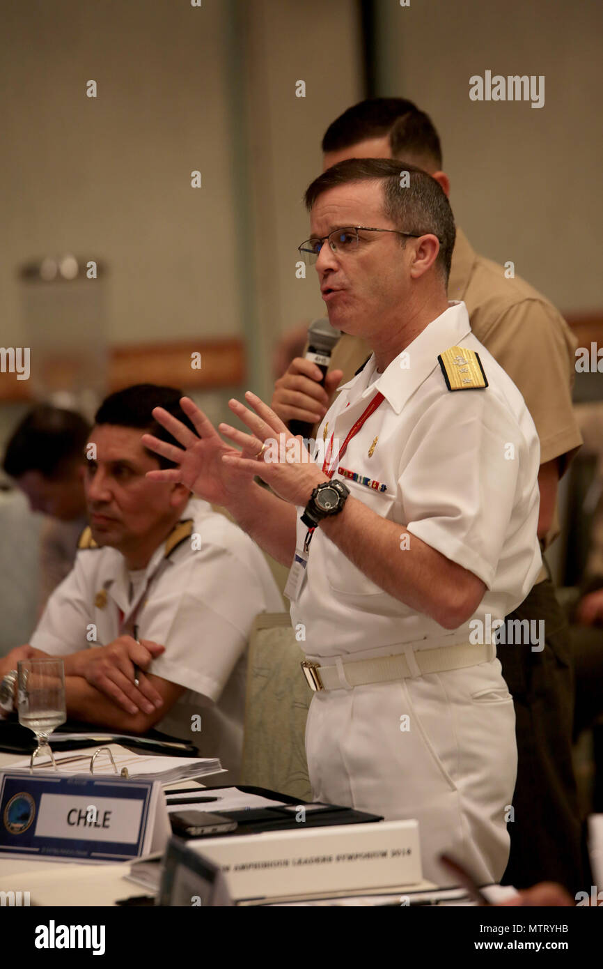 Chilean Marine Corps Rear Adm. Pedro Abrego Martinez, commanding general, Chilean Marine Corps, asks a question during the Pacific Amphibious Leaders Symposium (PALS) 2018 in Honolulu, Hawaii, May 22, 2018. PALS brings together senior leaders of allied and partner militaries with significant interest in the security and stability of the Indo-Pacific region to discuss key aspects of maritime/amphibious operations, capability development, crisis response, and interoperability. (U.S. Marine Corps photo by Cpl. Maximiliano Rosas) Stock Photo