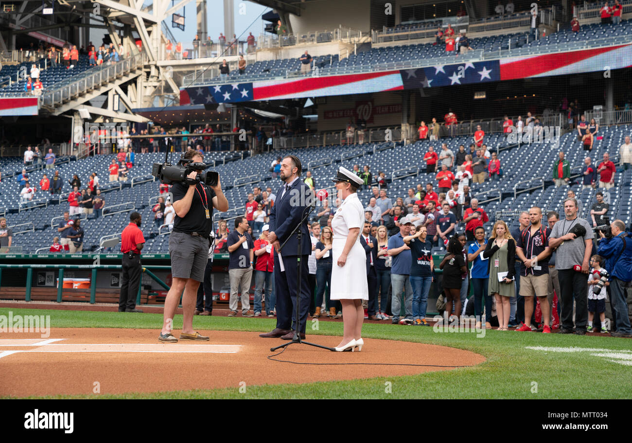 182205-N-PN185-037  WASHINGTON (May 22, 2018) Chief Musician Shana L. Sullivan performs the national anthem at Nationals Park in Washington. U.S. Rep. Martha McSally, a retired Air Force colonel, threw out the first pitch during the Washington Nationals’ “Women in the Military” celebration. (U.S. Navy photo by Musician 1st Class Eric Brown/Released) Stock Photo