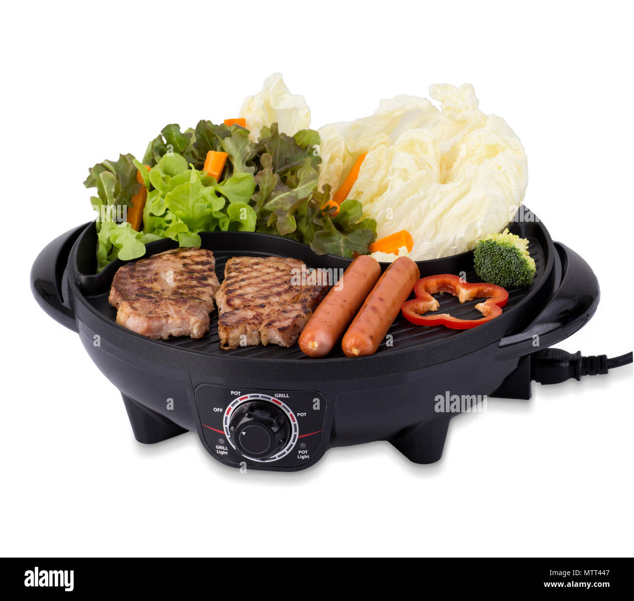 Grilled pork steak and sausages on the electric stove isolated on white