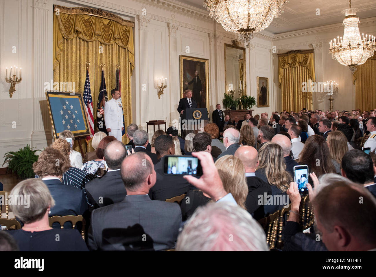 180524-N-BB269-005  WASHINGTON (May 24, 2018) President Donald J. Trump delivers remarks during the Medal of Honor ceremony in honor of retired Master Chief Special Warfare Operator (SEAL) Britt Slabinski at the White House in Washington, D.C. Slabinski received the Medal of Honor for his actions during Operation Anaconda in Afghanistan in March 2002. (U.S. Navy photo by Mass Communication Specialist 1st Class Raymond D. Diaz III/Released) Stock Photo