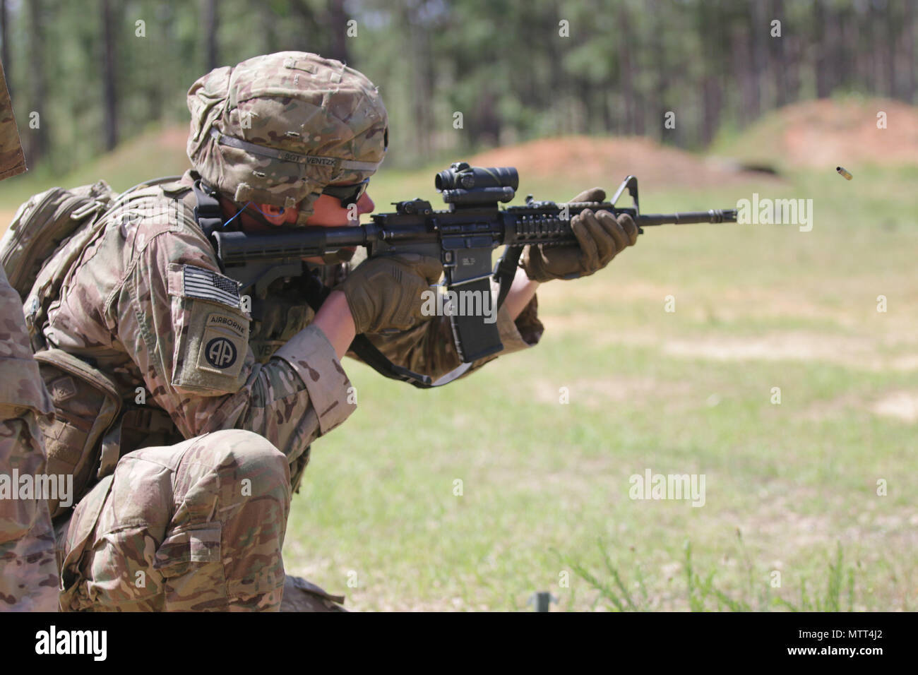 A U.S. Army paratrooper assigned to the 82nd Airborne Division fires an M4 Carbine during the last day of the Small Arms Competition as part of All American Week XXIX at Fort Bragg, North Carolina, May 23, 2018.  Paratroopers past and present converged on the center of the military universe to celebrate being members of the “All American” Division and America’s Guard of Honor. (U.S. Army photo by Sgt. Michelle U. Blesam) Stock Photo