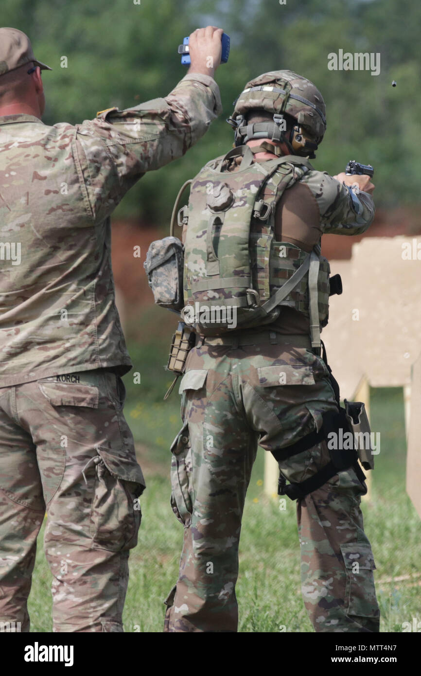 A U.S. Army paratrooper assigned to the 82nd Airborne Division fires an M9 pistol during the last day of the Small Arms Competition as part of All American Week XXIX at Fort Bragg, North Carolina, May 23, 2018.  Paratroopers past and present converged on the center of the military universe to celebrate being members of the “All American” Division and America’s Guard of Honor. (U.S. Army photo by Sgt. Michelle U. Blesam) Stock Photo