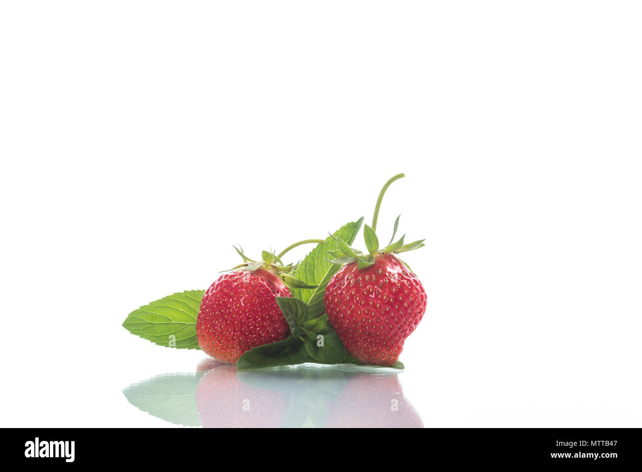 ripe red organic strawberry on a white background Stock Photo