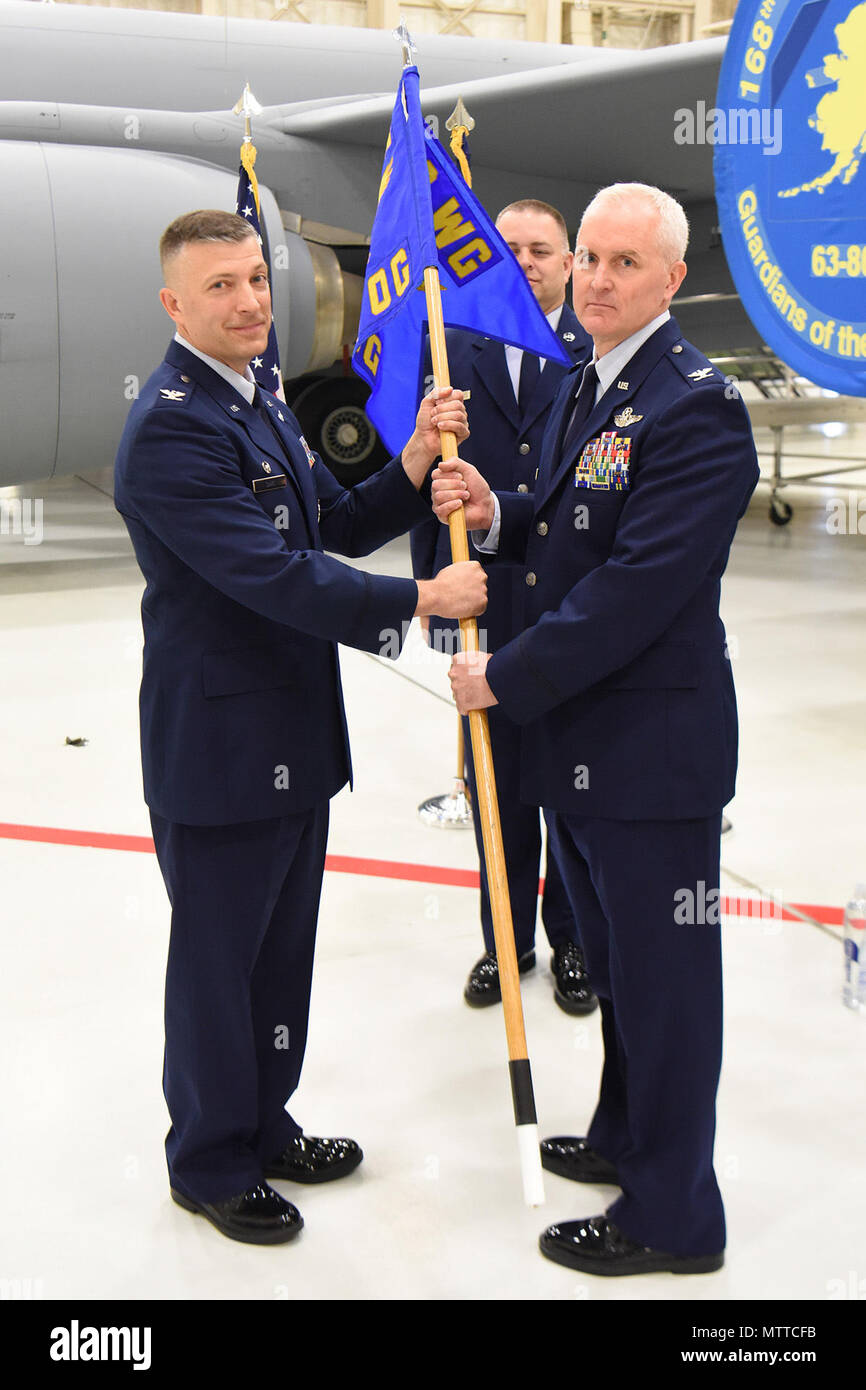 Col. Richard Adams receives the guidon from Col. Torrence Saxe and ...