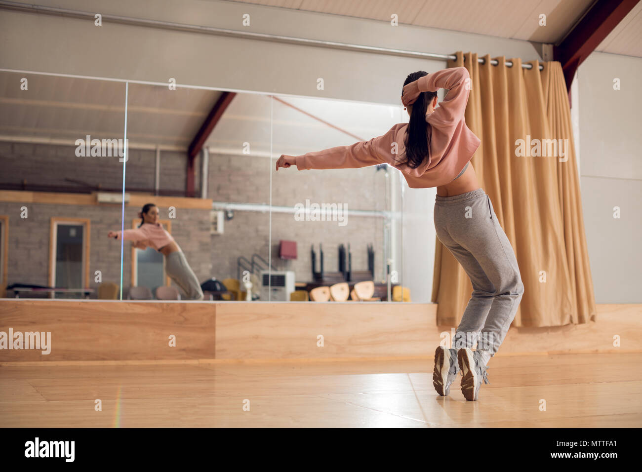 Female dancer dancing in dance studio Stock Photo