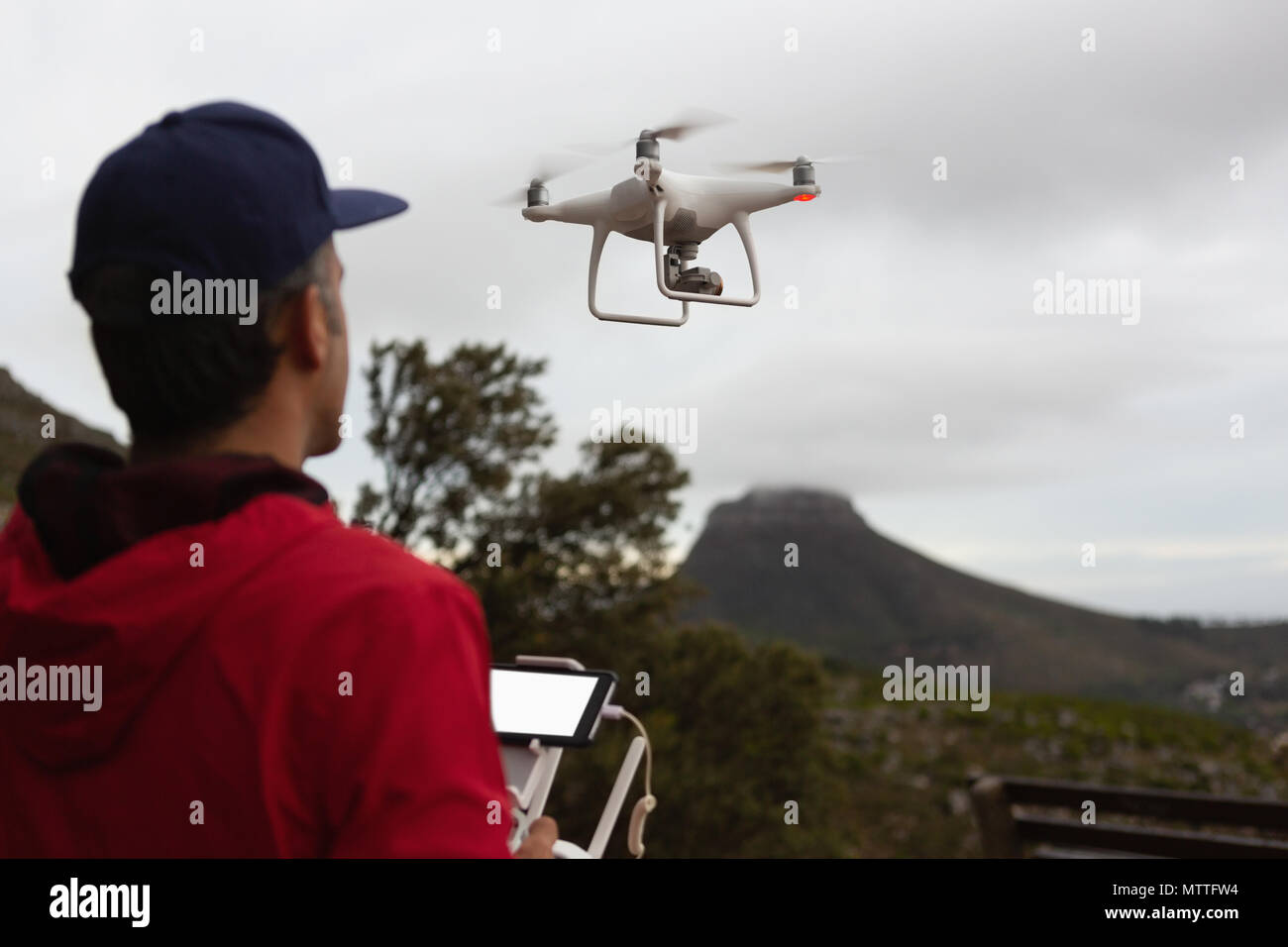 Man operating drone in hi-res stock photography and images - Alamy