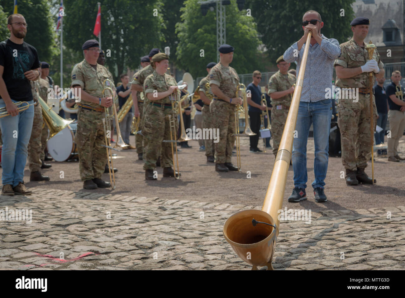 The alpine horn is performed during dress rehearsal for the Citadelle 350 anniversary military show.  US Army photo by Sgt Joseph Agacinski/released. Stock Photo