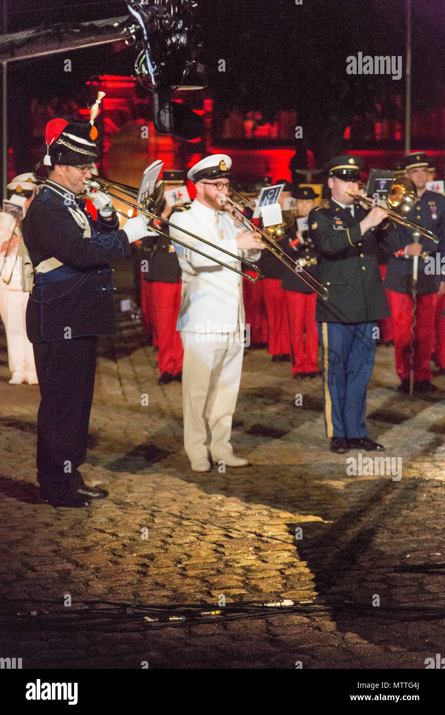 Spc Patrick Weiss, 3rd from the left, performs alongside the international trombone soloists for the Citadelle 350 anniversary military show, May 25, 2018, Lille, France.  US Army photo by Sgt Joseph Agacinski/released. Stock Photo